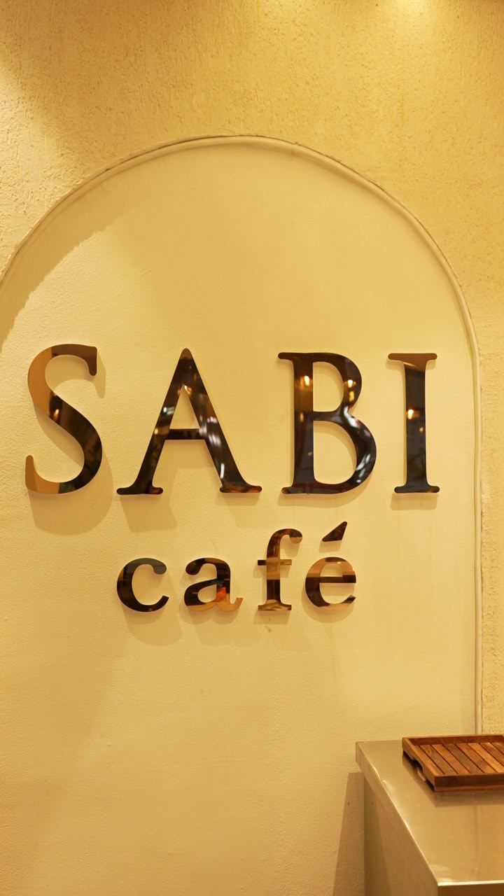SABI café lettering on the arched feature wall