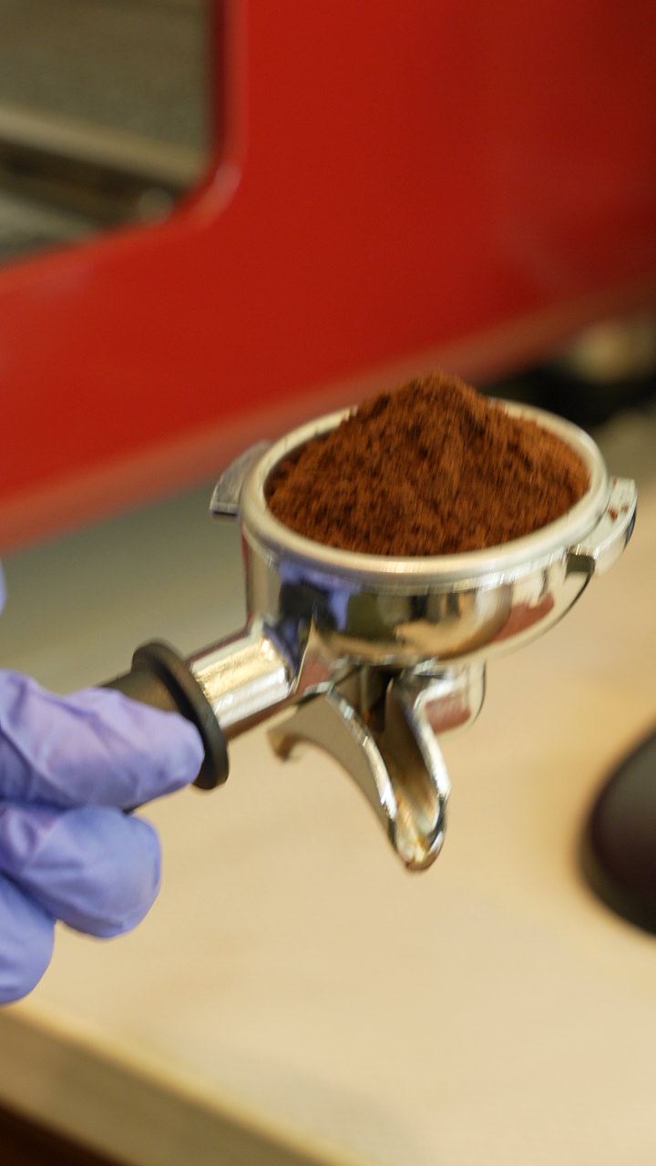 Freshly ground coffee in a portafilter